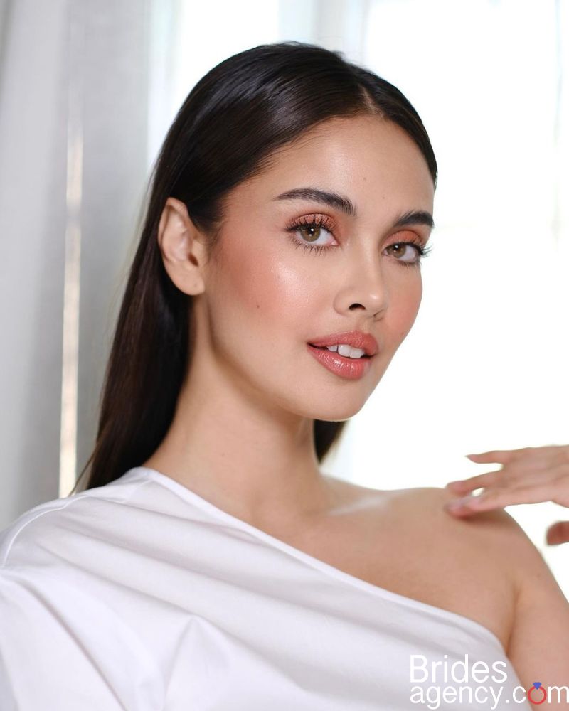 Megan Young delicate photo in a white dress
