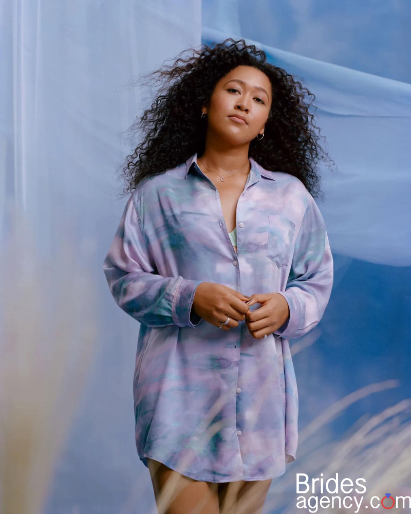 Naomi Osaka in a blue shirt