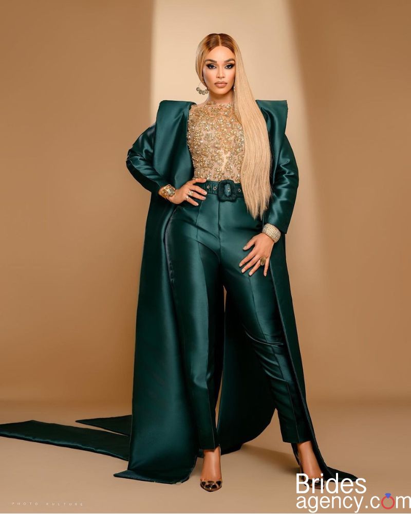 Pearl Thusi in a business green suit