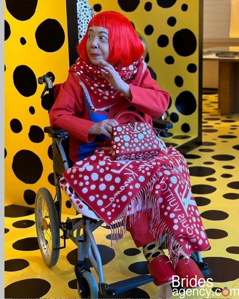 Yayoi Kusama in a wheelchair