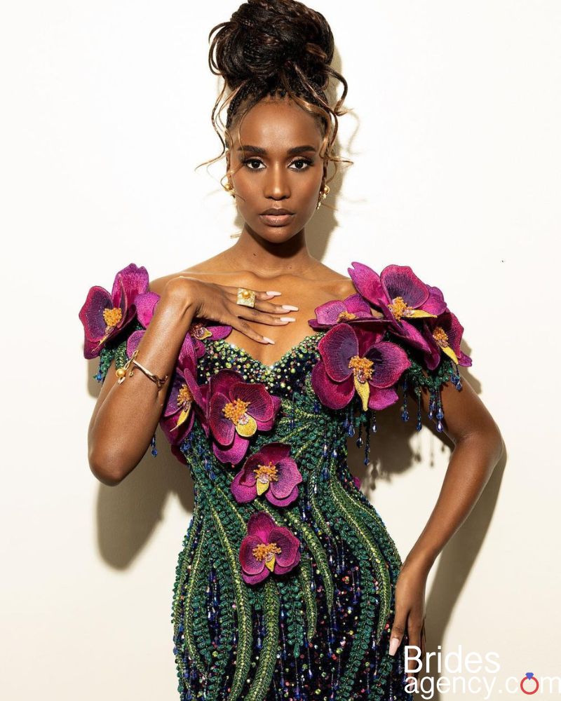 Zozibini Tunzi in a beautiful dress with flowers