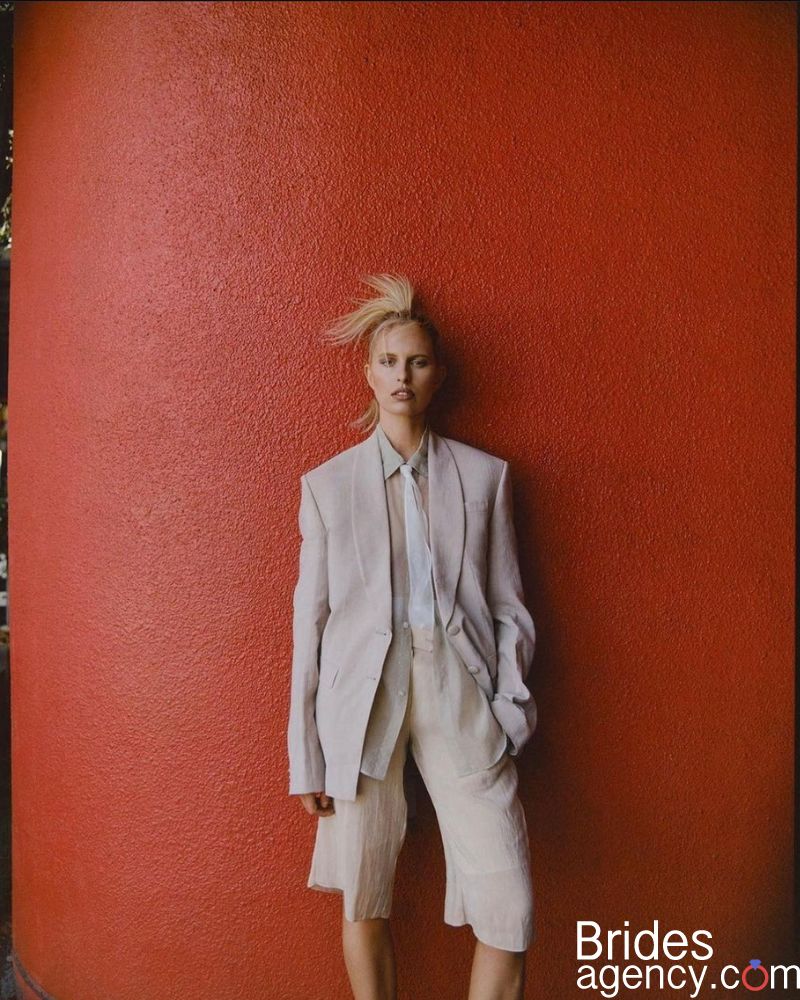 Karolina Kurkova on the background of a red wall