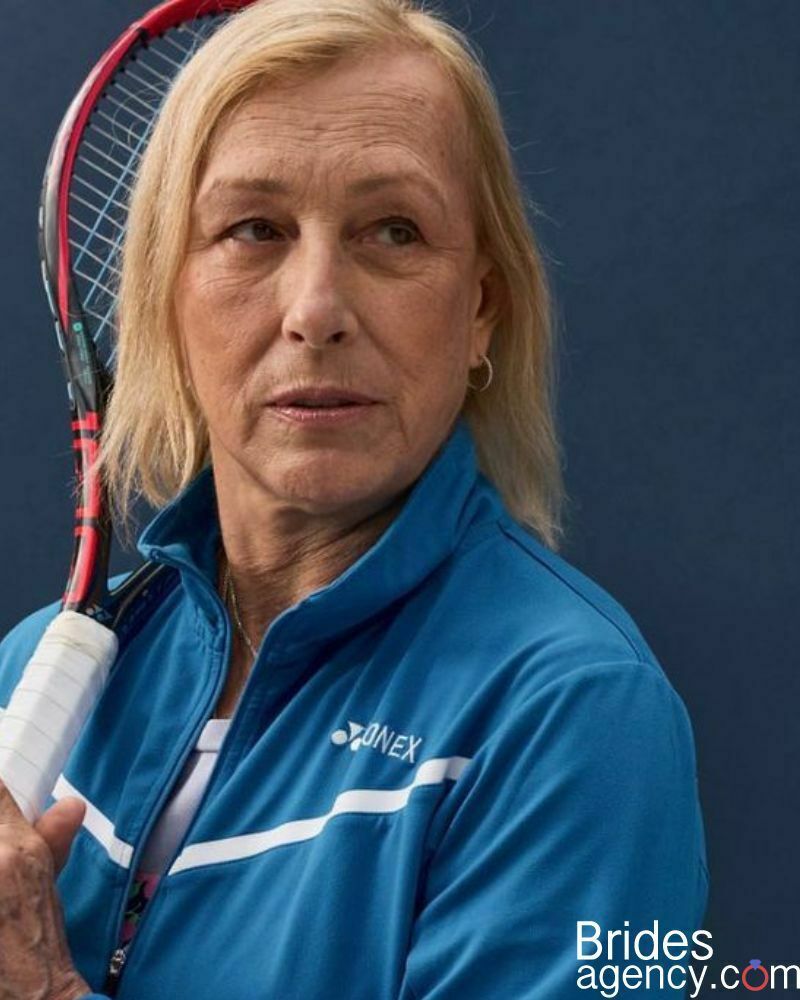 Martina Navratilova with a tennis racket