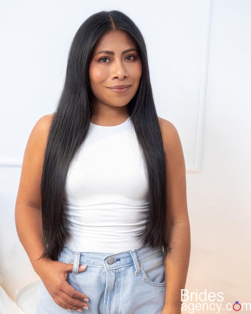 Yalitza Aparicio posing in jeans
