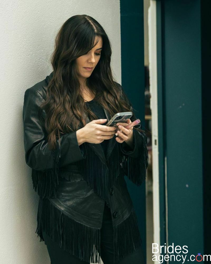 Marion Raven is looking at her phone
