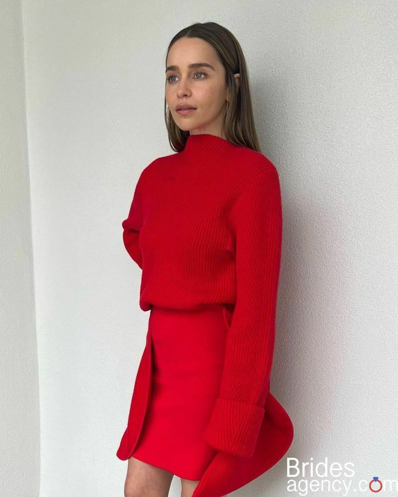 Emilia Clarke in a bright red dress