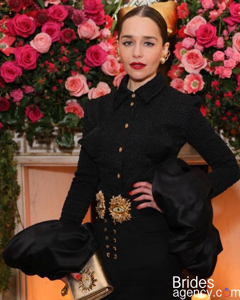 Emilia Clarke at the party in a black suit