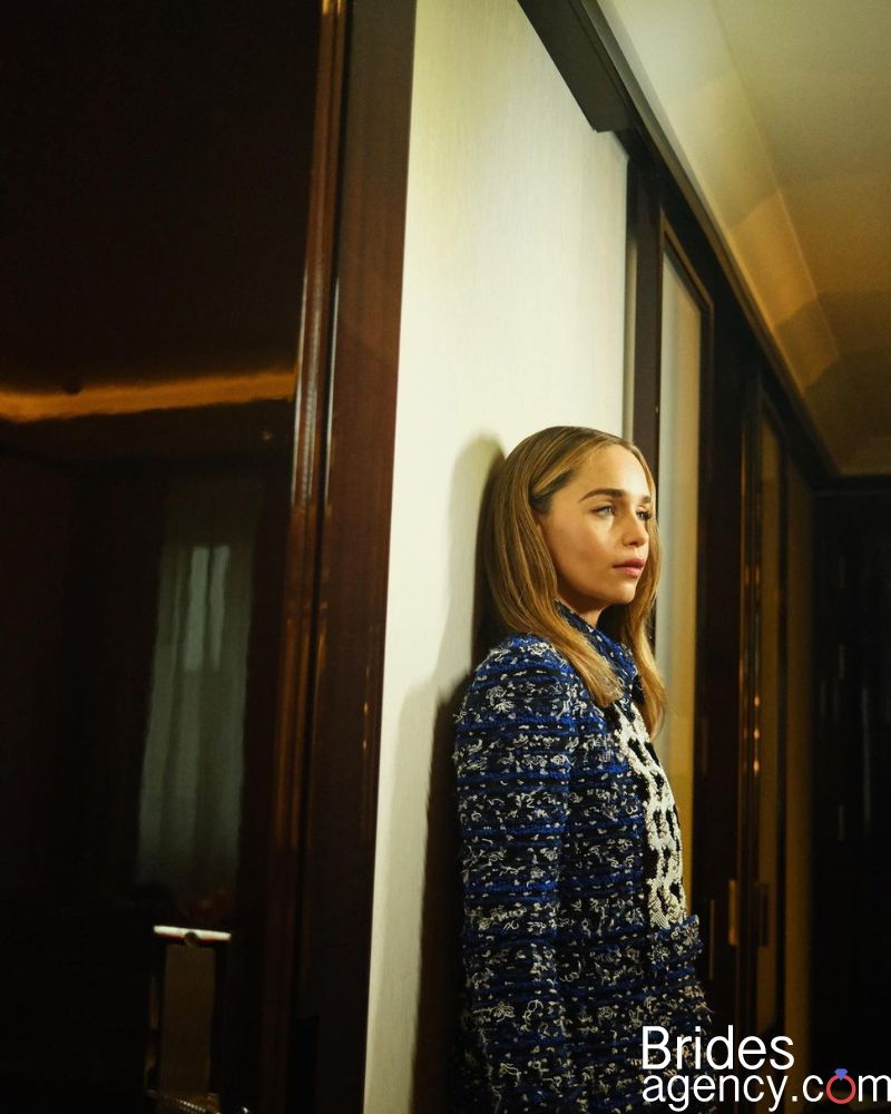 stylish photo of Emilia Clarke with subdued light